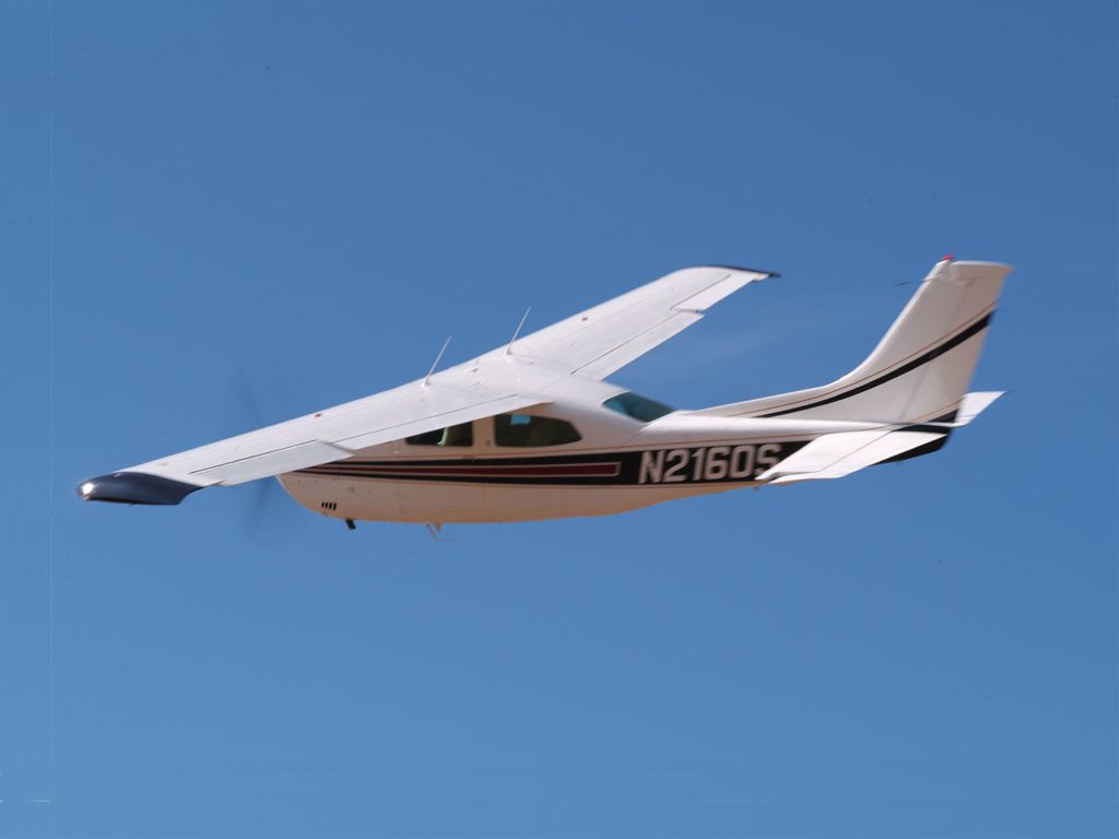 Cessna 210 Centurion N2160S in Flight Rear View